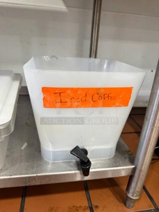 Plastic beverage dispenser missing lid, labeled "Iced Coffee," with spigot, fair condition.
