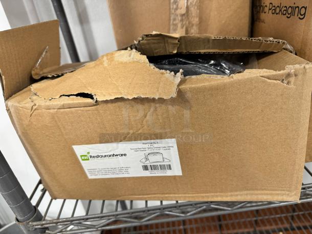 Brand new rectangle black plastic tabletop condiment caddy/interfold napkin dispenser in original box. Label indicates "Restaurantware" brand.