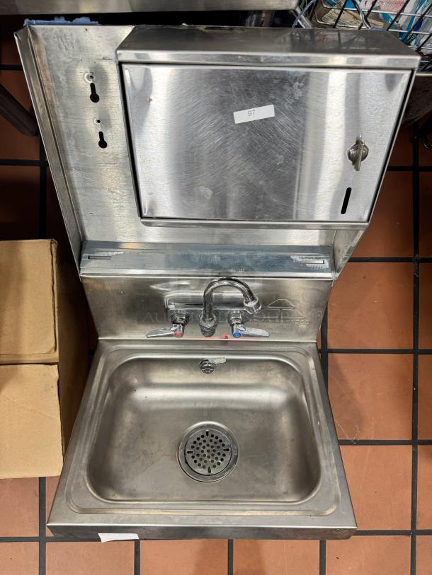 ADVANCE TABCO stainless steel wall-mounted hand sink with soap and paper towel dispenser, sturdy design, good condition.