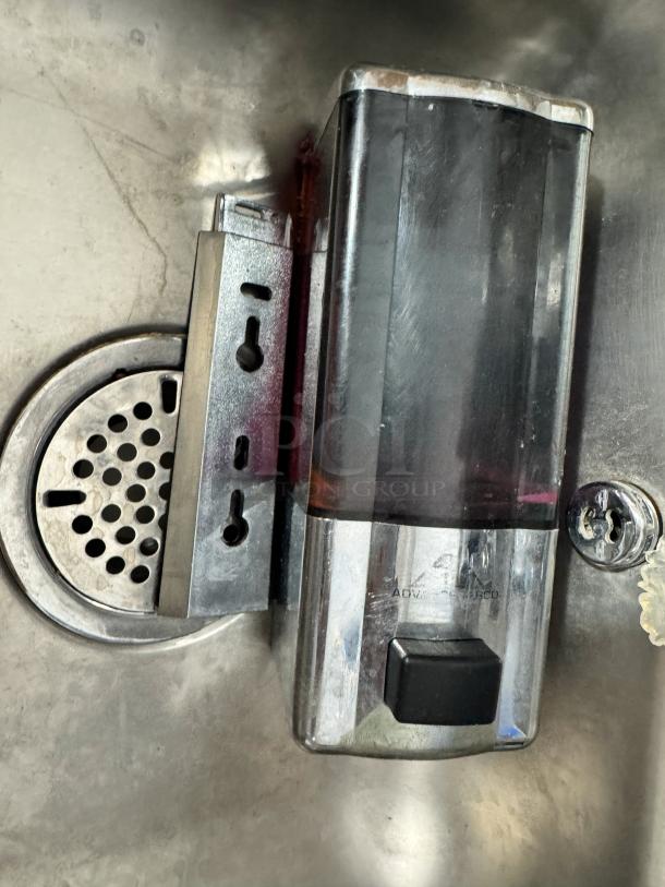 ADVANCE TABCO stainless steel hand sink with integrated soap and fold paper towel dispenser, wall-mounted, good condition.