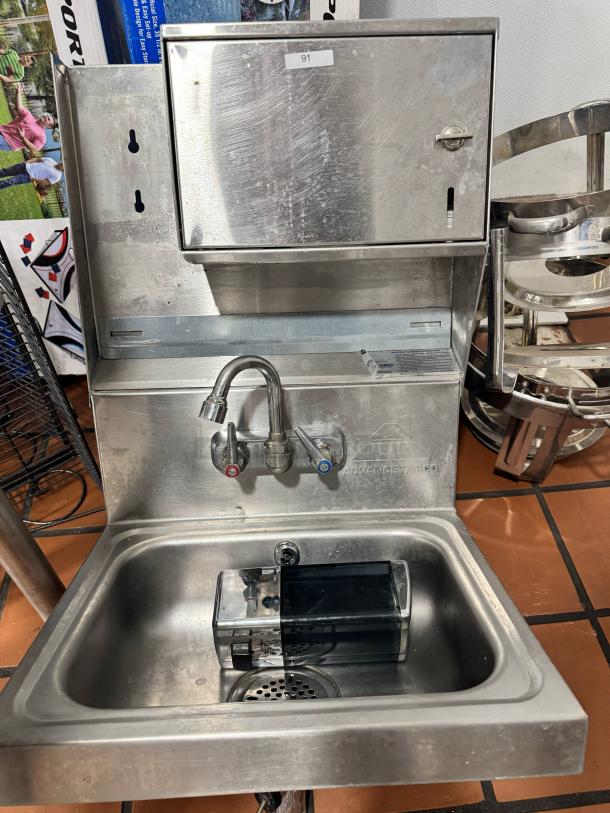 Advance Tabco stainless steel wall-mounted hand sink, includes soap and paper towel dispenser, durable, used condition.