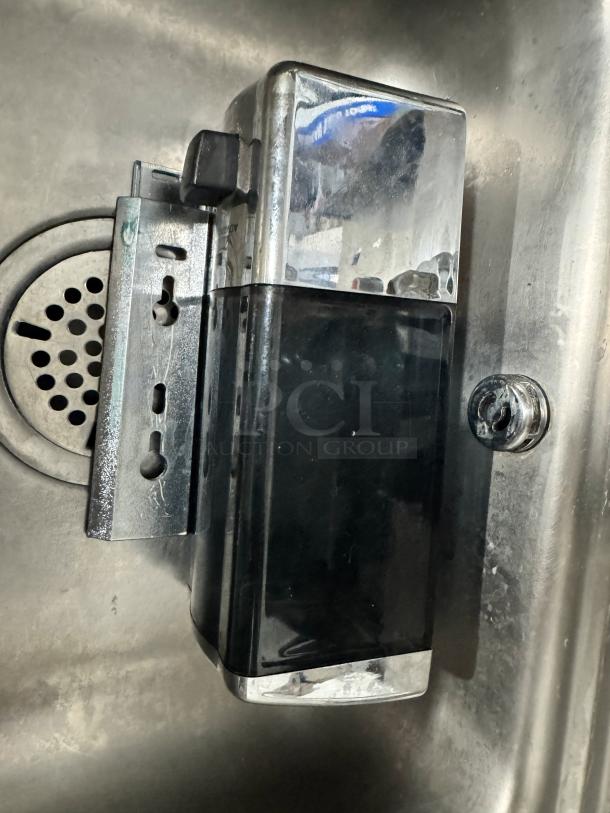 ADVANCE TABCO stainless steel hand sink with attached soap and paper towel dispenser, wall-mounted, clean condition.