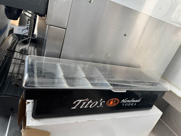 Tito's Handmade Vodka branded condiment tray with clear lid, used condition, suitable for bar or restaurant settings.