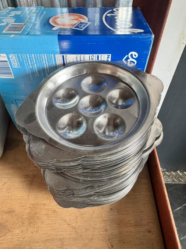 Stainless steel escargot dish BIDX25, six slots, stack of dishes, polished finish, excellent condition, ideal for serving escargot.