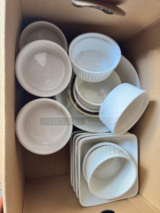 Box of miscellaneous porcelain dishes, includes ramekins and plates. All items appear white, condition is used.