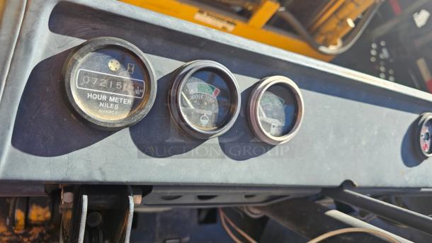 KOMATSU FG 15ST-2 forklift dashboard showing hour meter reading 7215. Good condition, clear gauges visible.