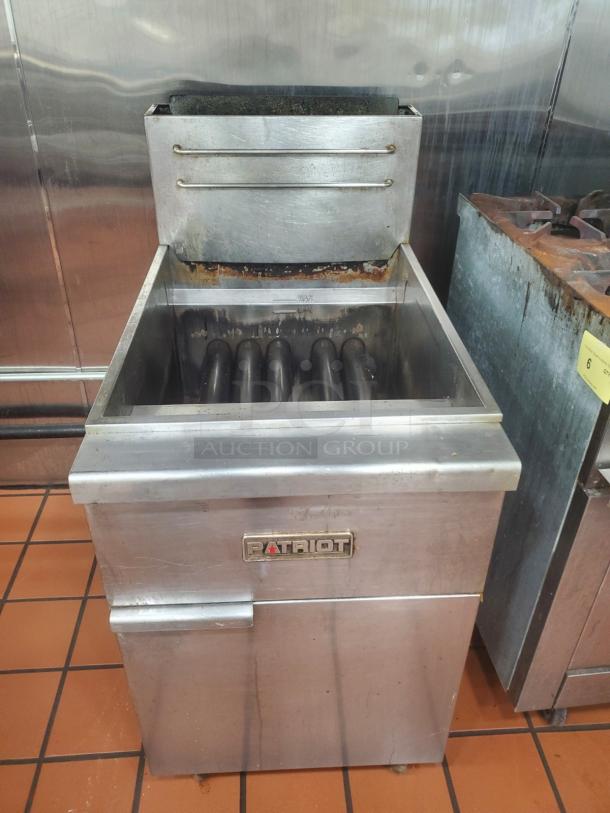 Patriot Natural Gas 40 lb Deep Fryer, stainless steel, visible wear, branded label, large oil capacity, industrial use.