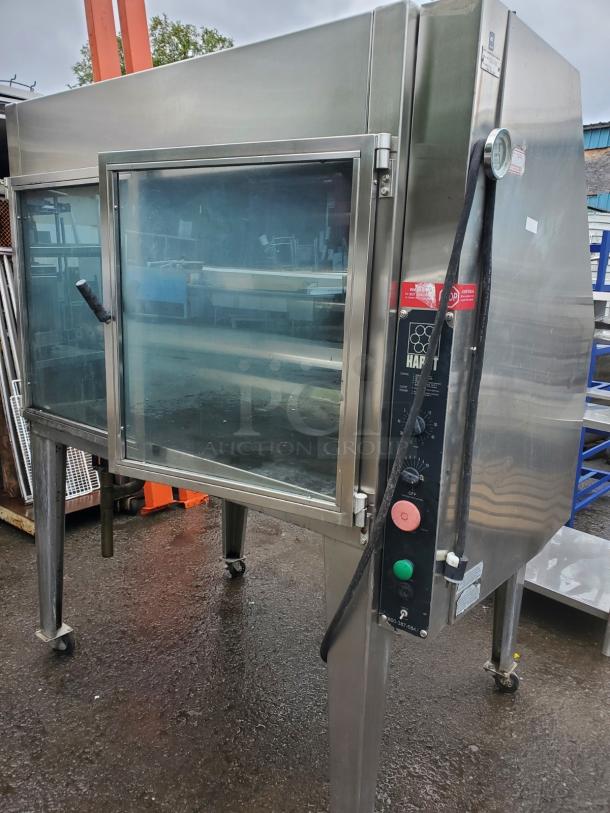 HARD INFERNO natural gas rotisserie oven, stainless steel, glass front, control panel, used condition, on casters.