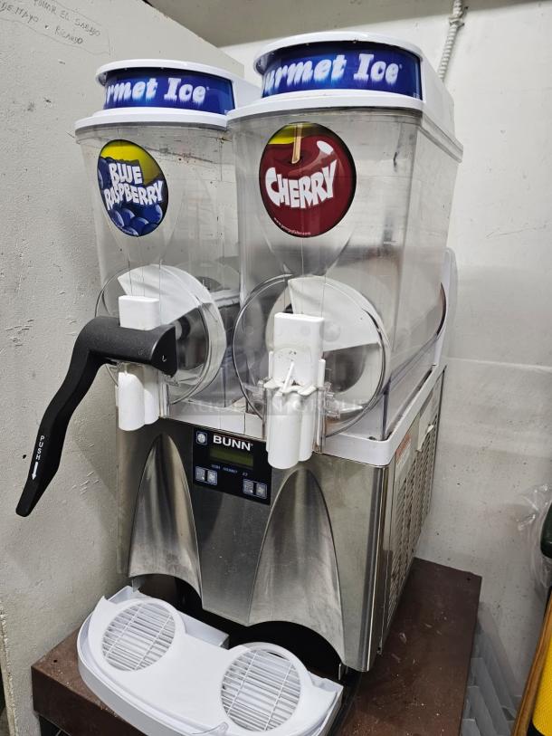 Bunn ULTRA-2 slushy machine with two dispensers, missing one handle. Tested and working. Visible labels: Blue Raspberry, Cherry.