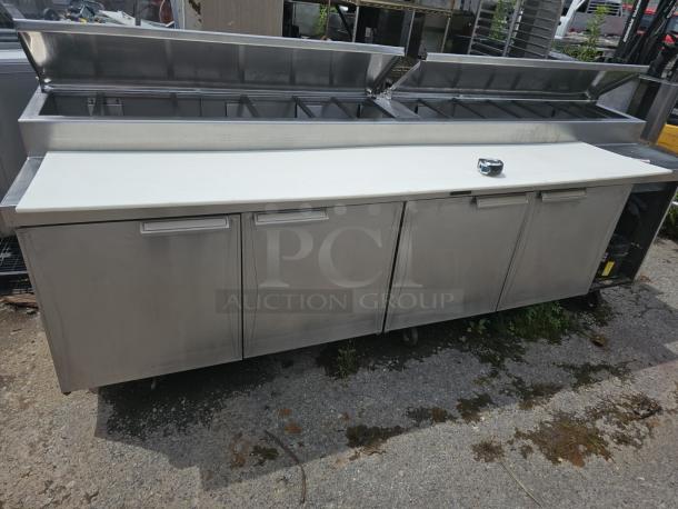 Randell 4-door prep table, stainless steel, tested and working, open-top design, minor wear, ideal for professional kitchens.