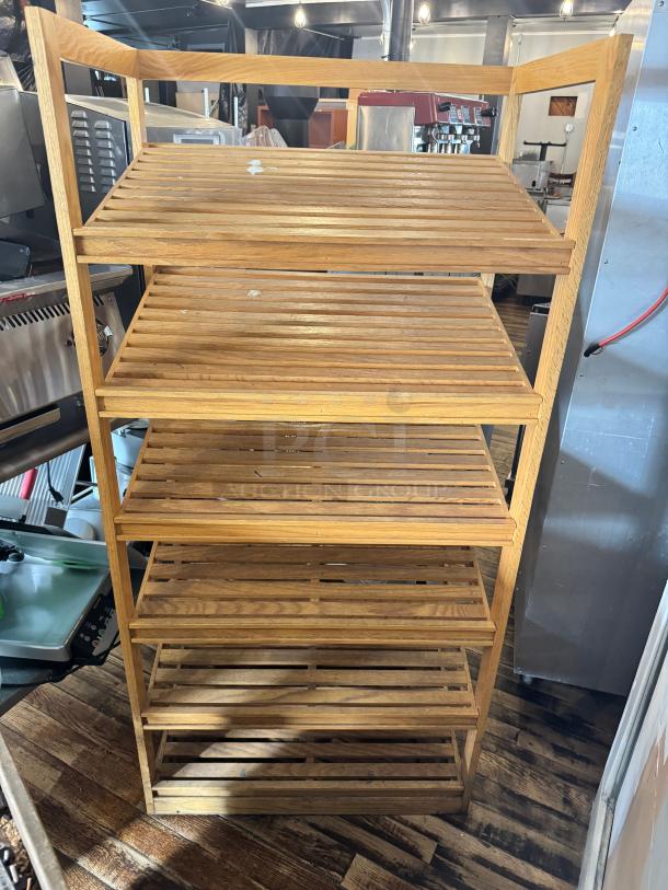 6-tier bamboo shelf with open slatted design, good condition. Ideal for storage or display, natural finish, sturdy construction.