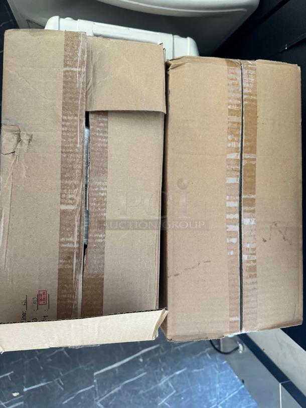 Two sealed cardboard boxes containing GENERIC 15x20 produce roll bags, eight rolls total, in new condition.
