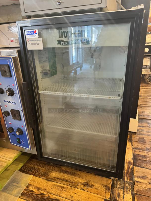 TRUE GDM-07 glass door cooler merchandiser with two shelves, Pepsi label, in good condition, ideal for beverage display.
