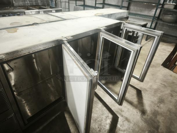 Glastender BB84-L1-XN back bar refrigerator with three glass doors open, stainless steel interior, used condition.