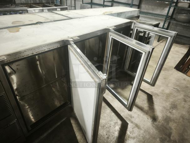 Glastender BB84‑L1‑XN back bar refrigerator, stainless steel, three-section, with open glass doors, in used condition.
