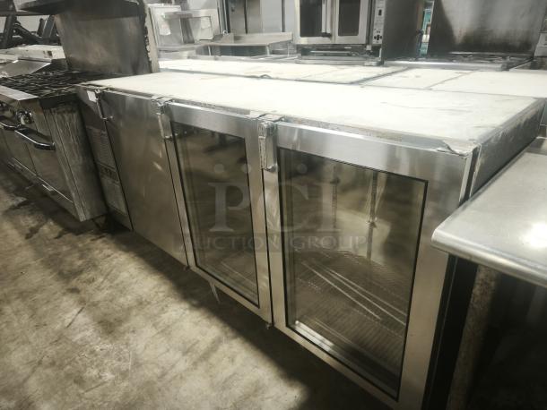 Glastender BB84‑L1‑XN (RRR) back bar refrigerator, three-section, stainless steel, glass doors, commercial use, good condition.