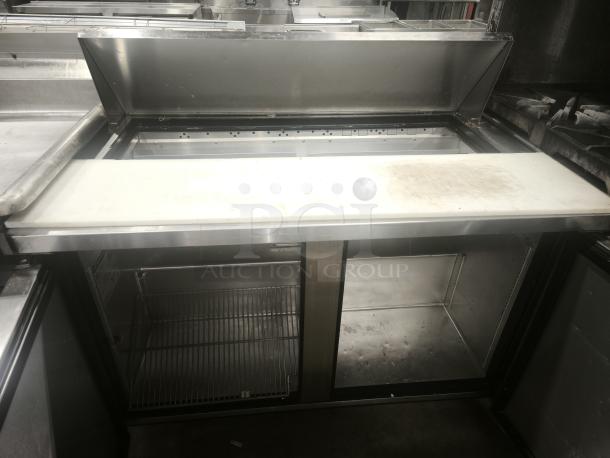 True TSSU‑48‑12‑HC refrigerated prep table, featuring a chilled storage compartment, stainless steel finish, clean surface.