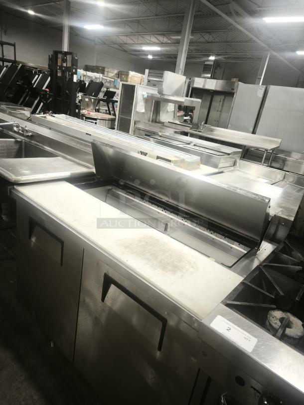 True TSSU‑48‑12‑HC refrigerated prep table, 48" wide, stainless steel, with work surface, commercial kitchen use.