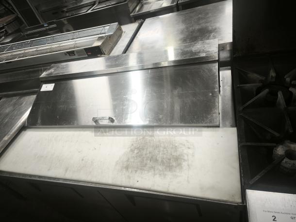 True 48" refrigerated prep table model TSSU‑48‑12‑HC, stainless steel, shows signs of use, designed for commercial kitchens.