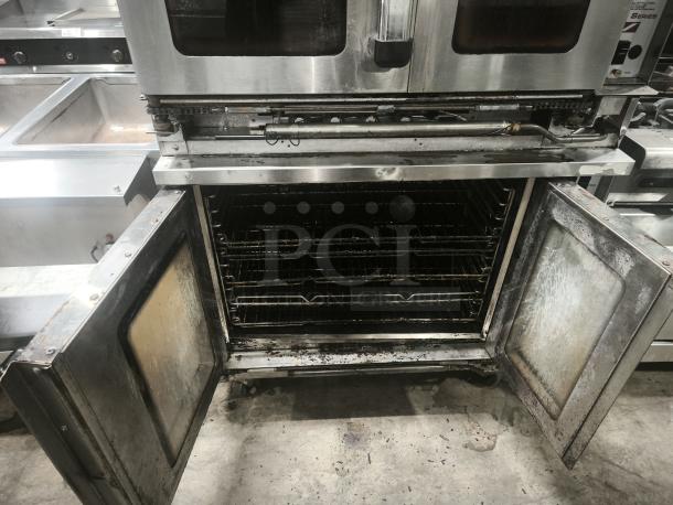 Southbend PCE15S/SI double convection oven, stainless steel, used, open doors, 7.5kW, 240v/3ph, interior racks visible.