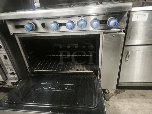 Imperial IR-6 36" 6 Burner Gas Range with Standard Oven, open door, natural gas, blue knobs, used condition.