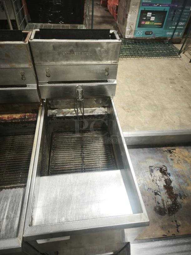 Southbend SB45S floor model gas fryer, 42-50 lbs capacity, 14"x14" fry area, stainless steel, industrial setting, used condition.