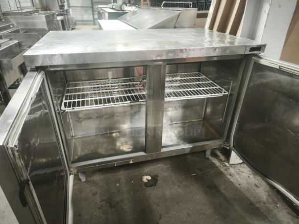 Kelvinator KCHUC48F 48" undercounter freezer with two sections and doors, stainless steel, commercial use, 115v, open view.