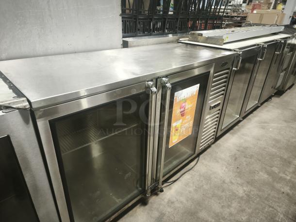 Krowne Metal BS60R‑KSS‑LR back bar refrigeration unit, stainless steel, glass doors, excellent condition, visible interior shelves.
