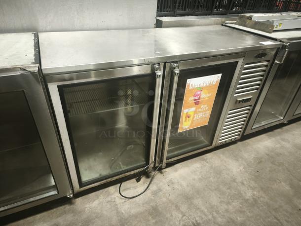 Krowne Metal BS60R‑KSS‑LR Back Bar Refrigeration, stainless steel, glass doors, fair condition, interior shelves visible.