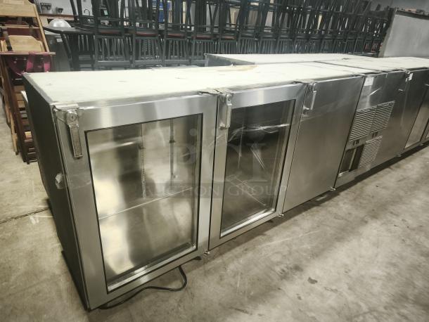 Glastender 84" stainless steel back bar cooler with 3 glass doors, model BB84-L1-XS(RRR), displayed in excellent condition.