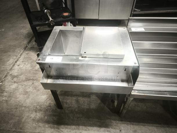 Stainless steel under bar ice bin, model MF48, 24 inches, heavy-duty, includes visible wear and a capacity tag.