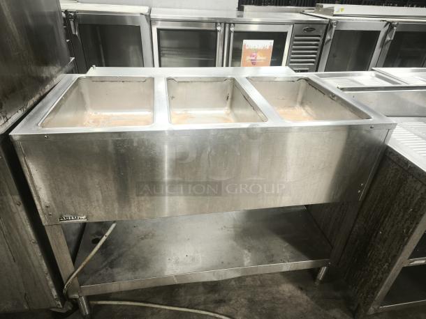 Heavy-duty stainless steel steamer with three compartments. Used condition, ideal for commercial kitchens. Altime label visible.