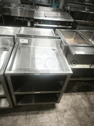 Heavy-duty stainless steel pan rack with two open shelves, visible label "24 QTY", ideal for commercial kitchens.