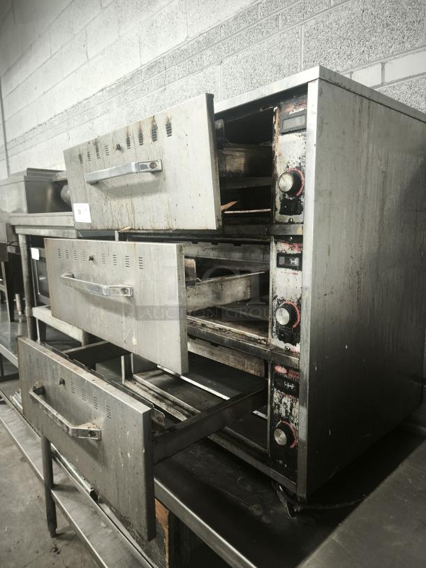 Hatco HDW-3 warming drawer with 3 compartments, 29.5" wide, stainless steel, visible wear, 120v model, adjustable knobs.