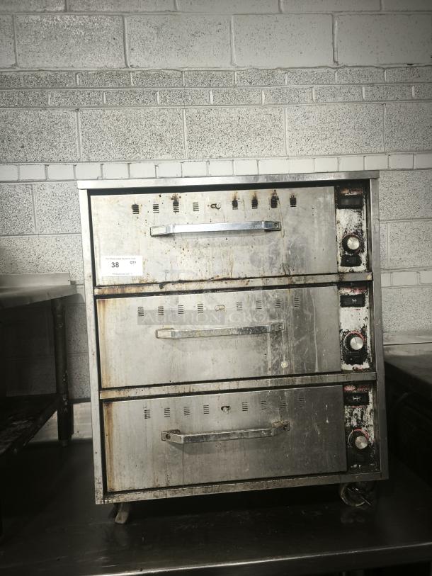 Hatco HDW-3 warming drawer, freestanding, 29.5"W, with 3 compartments. Stainless steel, visible wear, model label on side.