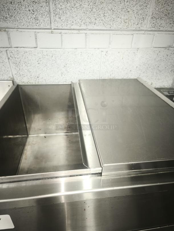 Heavy-duty underbar ice bin and cocktail unit with built-in 7-circuit cold plate; sturdy stainless steel, good condition.
