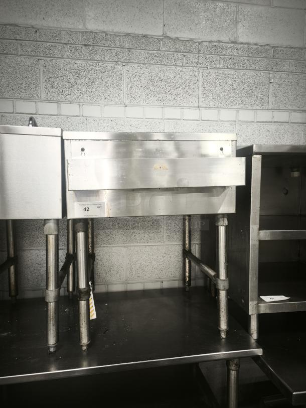 Krowne Bar Drain Board 21-GS24 in stainless steel, with sturdy legs, industrial setting. Model 21-GS24 label visible.