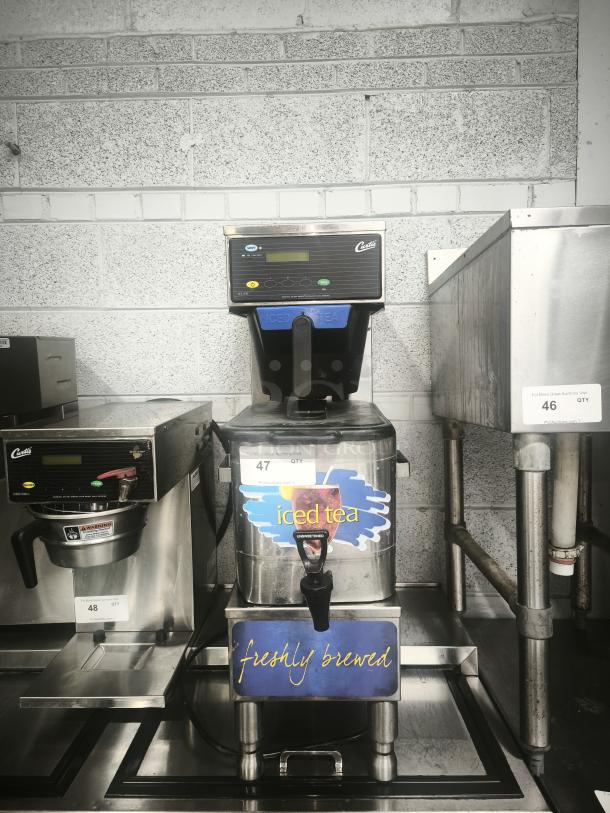Curtis TBP 3 Gallon Low Profile Universal Tea Brewer with Dispenser, 120V. Includes "iced tea" and "freshly brewed" labels.