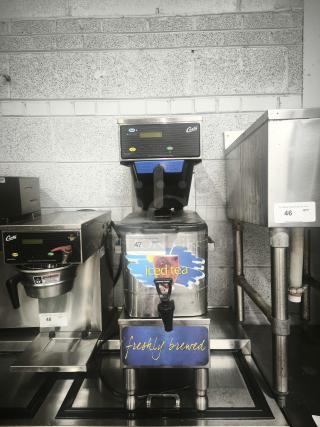 Curtis TBP 3 Gallon Low Profile Universal Tea Brewer with Dispenser, 120V. Includes "iced tea" and "freshly brewed" labels.