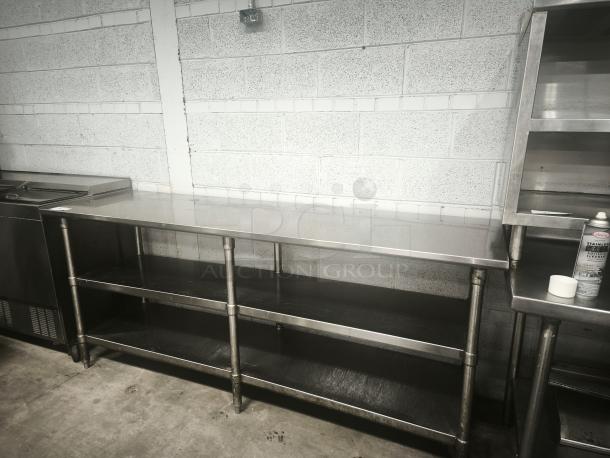 Glastender MF48-SF2 stainless steel work table with 2 shelves, clean condition, durable for commercial use.