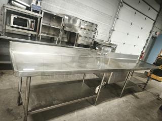 Glastender MF48-SF2 stainless steel prep table with sink, cutting board, and undershelf. Durable, used condition.