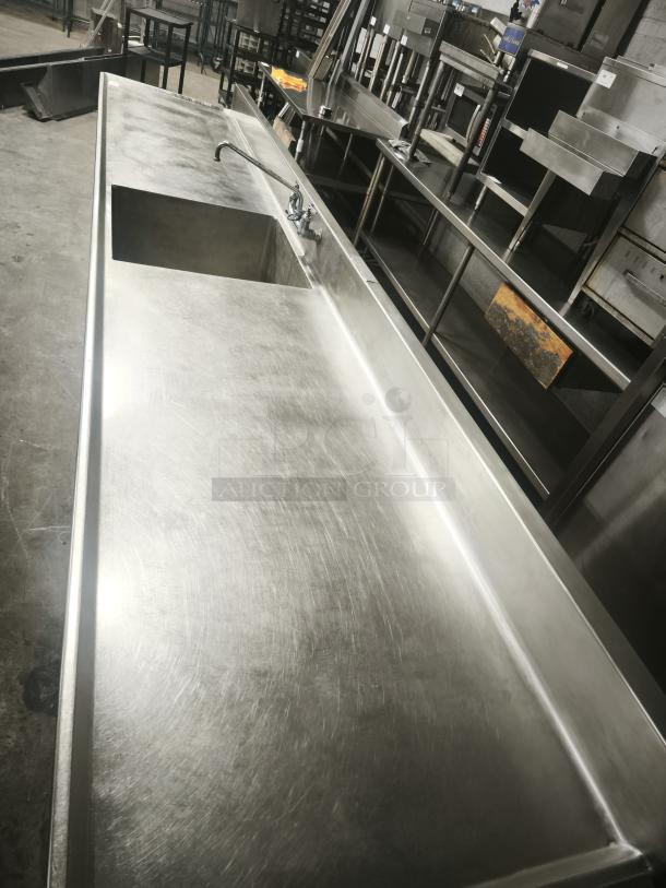 Stainless steel prep table by Glastender, model MF48-SF2. Includes sink, cutting board, undershelf; excellent condition.