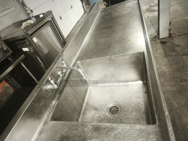 Glastender stainless steel prep table with sink, cutting board, and undershelf, model MF48-SF2, in used condition.