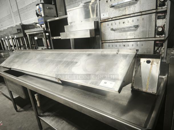 Stainless steel kitchen shelf, industrial design, visible surface wear, dimensions approx. 6 ft long, auction tag #58.