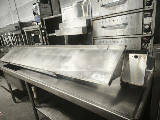 Stainless steel kitchen shelf, industrial design, visible surface wear, dimensions approx. 6 ft long, auction tag #58.