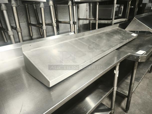 Stainless steel kitchen shelf, modern design, excellent condition, robust construction, perfect for commercial use.
