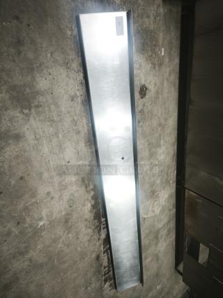 Stainless steel kitchen shelf, long and sleek, with a reflective surface. Good condition, labeled with ID tag "10".