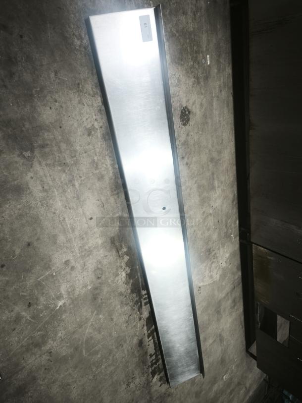 Stainless steel kitchen shelf, sleek design, new condition, rectangular shape, wall-mounted with visible mounting hole.