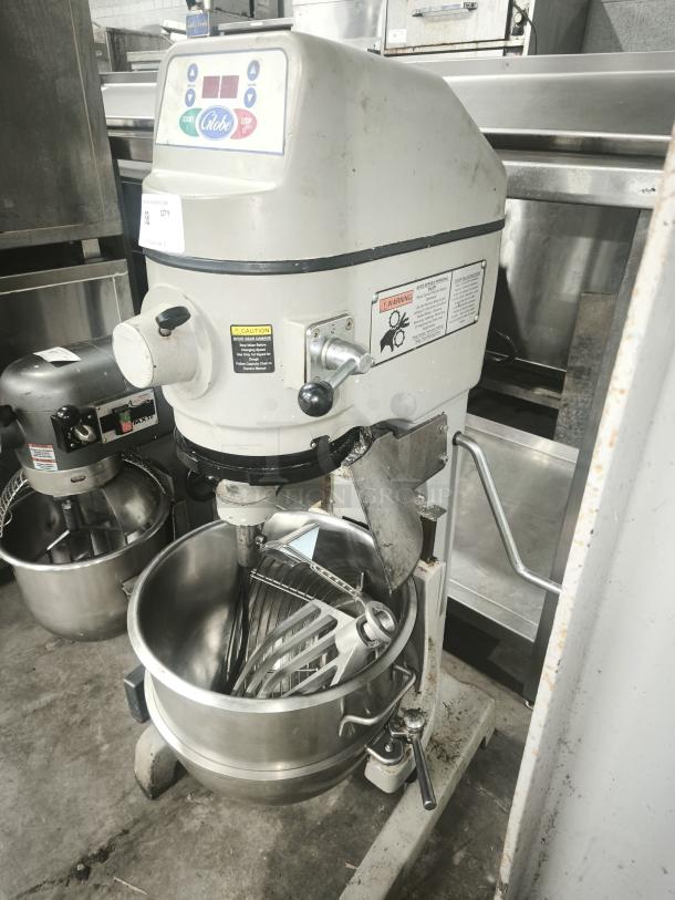 Globe SP30 30 qt planetary mixer, floor model, heavy-duty, 1 hp, 115v, includes attachments, visible labels, used condition.