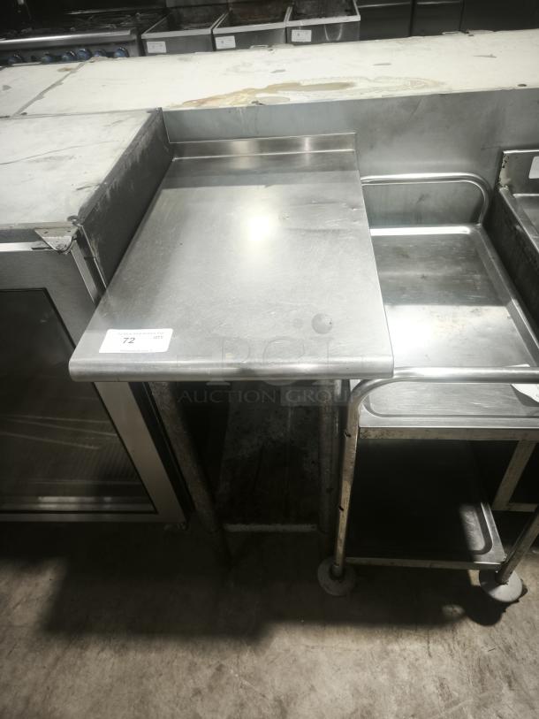 Heavy-duty small stainless steel prep table with raised backsplash, open shelving below, good condition.